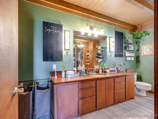 10696 N County Road 3410, Stratford, OK 74872 - full bath with vanity, wood finished floors, and a wooden ceiling with exposed beams