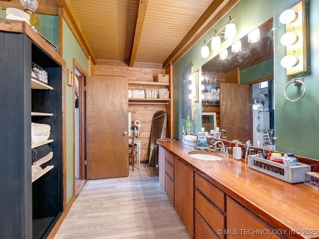 10696 N County Road 3410, Stratford, OK 74872 - bathroom with wood finished floors, vanity, and a wooden ceiling with exposed beams