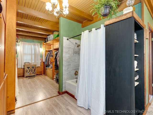 10696 N County Road 3410, Stratford, OK 74872 - full bath with a wood ceiling with exposed beams, wood finished floors, shower / bathtub combination with curtain, and a chandelier