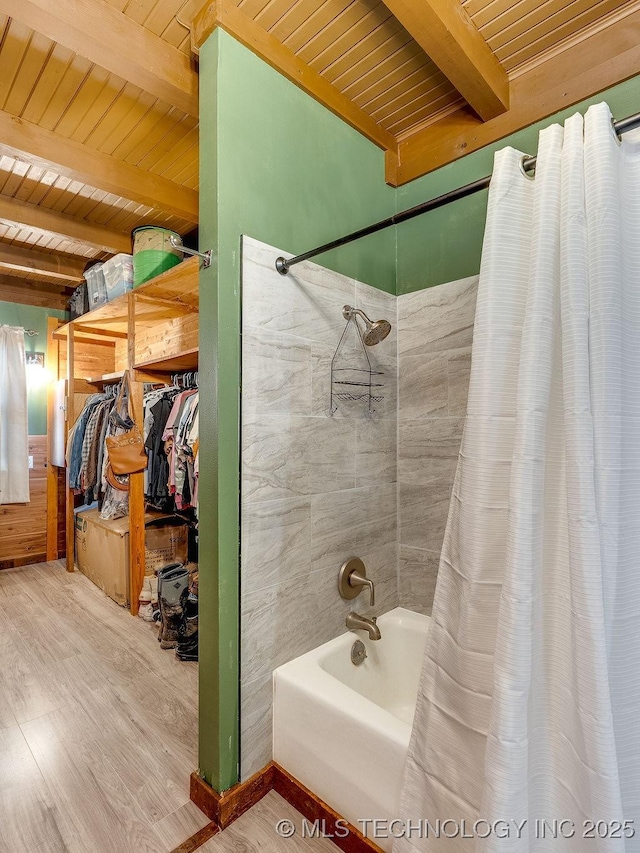 10696 N County Road 3410, Stratford, OK 74872 - bathroom with a wooden ceiling with exposed beams, shower / bathtub combination with curtain, and wood finished floors
