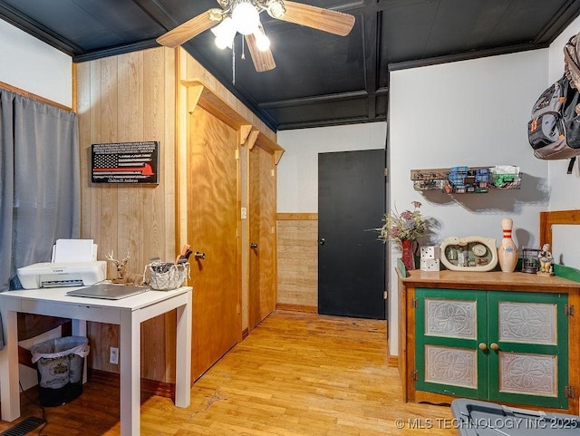 10696 N County Road 3410, Stratford, OK 74872 - kitchen with wood walls, ceiling fan, and light wood-type flooring