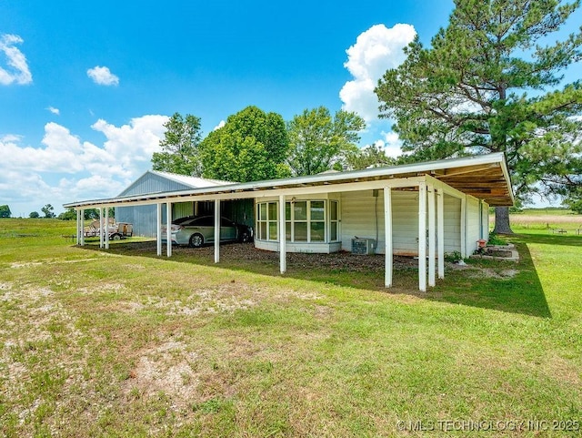 10696 N County Road 3410, Stratford, OK 74872 - view of property exterior featuring a lawn and a central AC unit