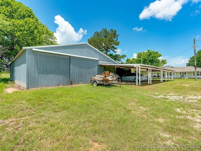 10696 N County Road 3410, Stratford, OK 74872 - view of green lawn featuring a pole building and an outbuilding