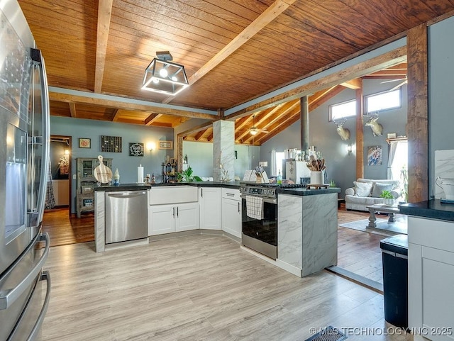 10696 N County Road 3410, Stratford, OK 74872 - kitchen with appliances with stainless steel finishes, wooden ceiling, light wood finished floors, dark countertops, and open floor plan