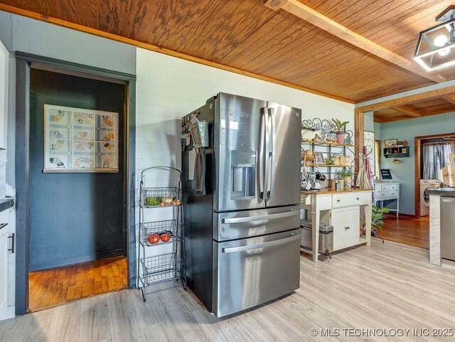 10696 N County Road 3410, Stratford, OK 74872 - kitchen with stainless steel fridge, wooden ceiling, light wood-style flooring, and washer / dryer