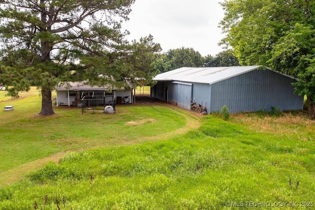 10696 N County Road 3410, Stratford, OK 74872 - view of grassy yard featuring an outbuilding and an outdoor structure