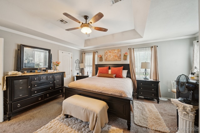 13605 E 90th Ct, Owasso, OK 74055 - carpeted bedroom featuring a tray ceiling, crown molding, and a ceiling fan