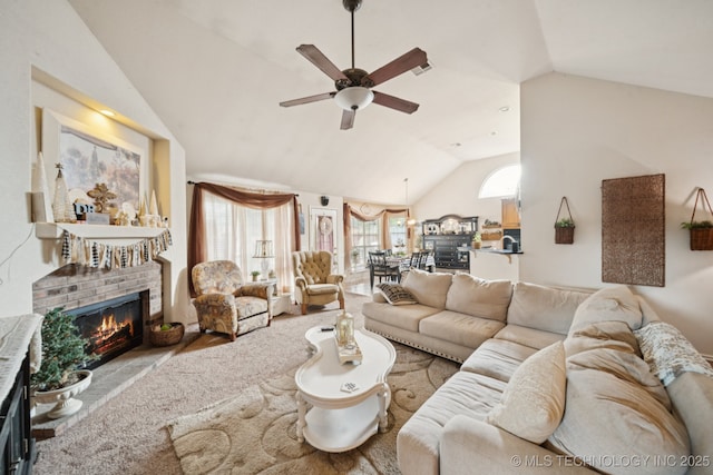 13605 E 90th Ct, Owasso, OK 74055 - living room with vaulted ceiling, ceiling fan, and a fireplace