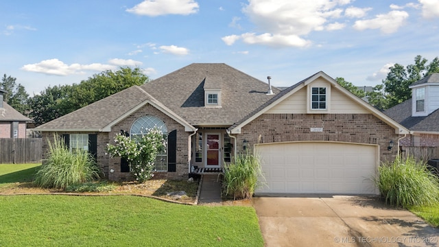 13605 E 90th Ct, Owasso, OK 74055 - view of front facade featuring brick siding, concrete driveway, a garage, and roof with shingles