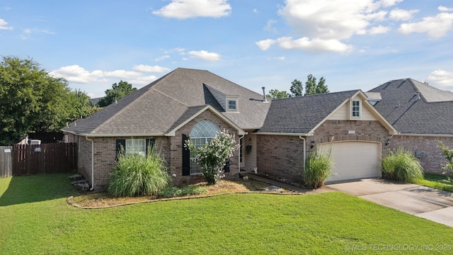 13605 E 90th Ct, Owasso, OK 74055 - view of front facade featuring brick siding, driveway, a garage, and a shingled roof