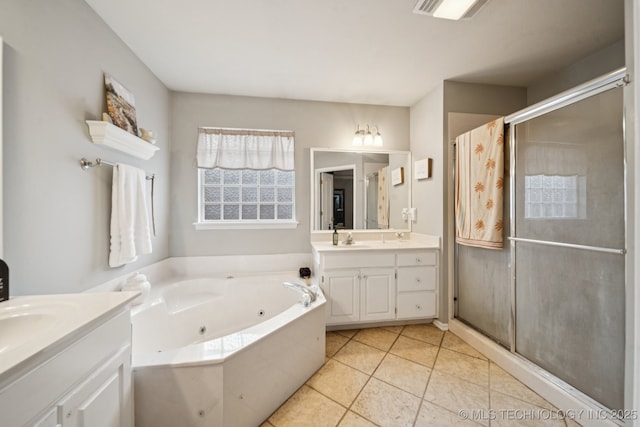 13605 E 90th Ct, Owasso, OK 74055 - full bath with two vanities, a stall shower, a jetted tub, and tile patterned floors