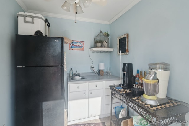 13605 E 90th Ct, Owasso, OK 74055 - kitchen featuring freestanding refrigerator, a ceiling fan, ornamental molding, white cabinets, and light countertops