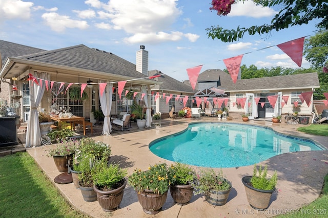 13605 E 90th Ct, Owasso, OK 74055 - view of swimming pool featuring a patio
