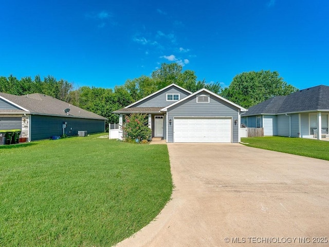 1125 Emily Ln, Ada, OK 74820 - view of front of home featuring driveway, a front lawn, and an attached garage
