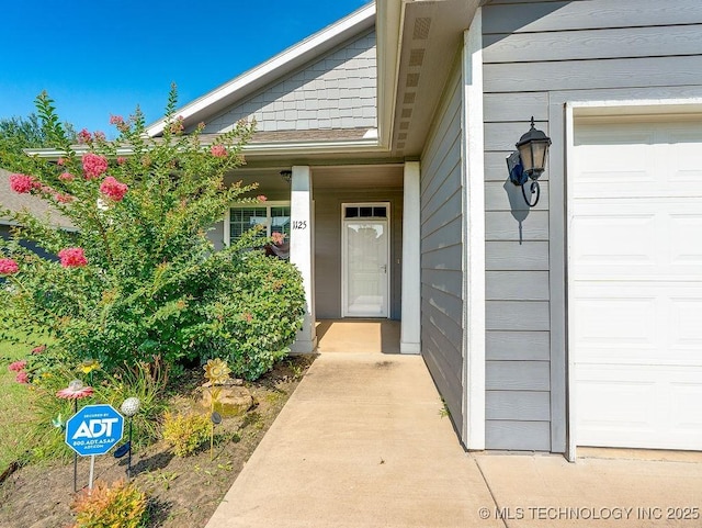 1125 Emily Ln, Ada, OK 74820 - doorway to property with an attached garage
