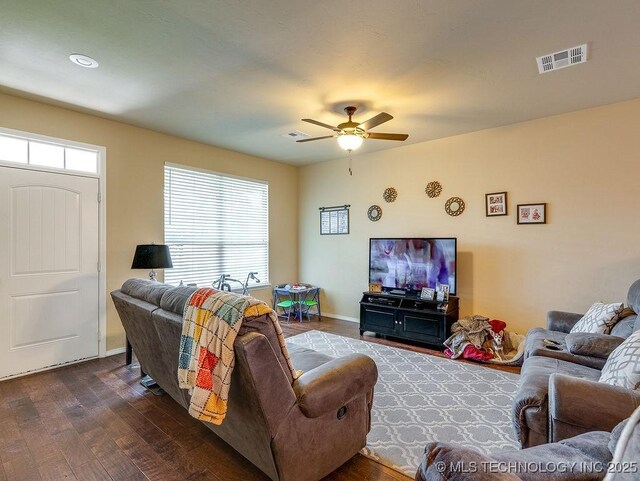 1125 Emily Ln, Ada, OK 74820 - living area featuring dark wood-style flooring and ceiling fan