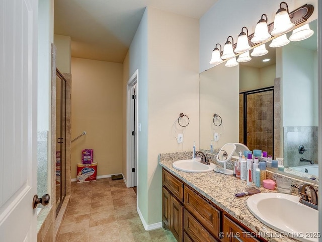 1125 Emily Ln, Ada, OK 74820 - bathroom with a stall shower, double vanity, and a tub