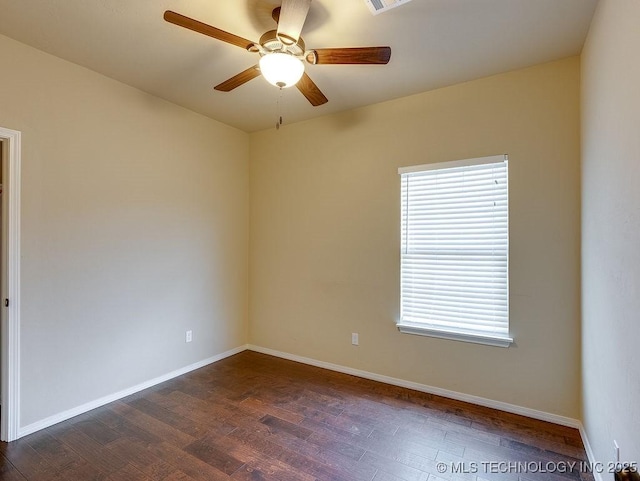 1125 Emily Ln, Ada, OK 74820 - empty room featuring dark wood finished floors and ceiling fan