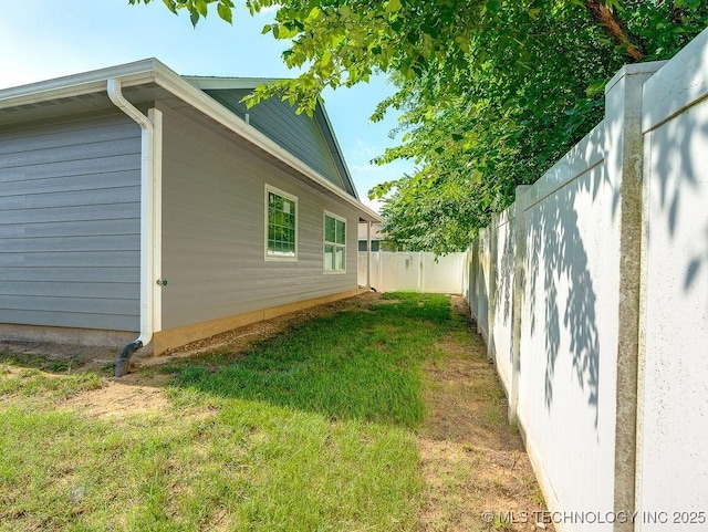 1125 Emily Ln, Ada, OK 74820 - view of side of property featuring a fenced backyard