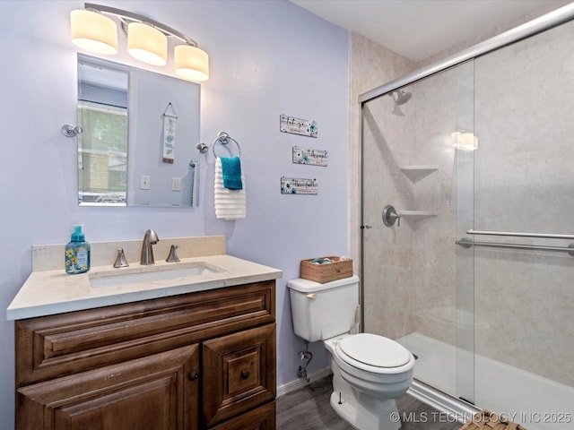 5229 Nowata Rd Unit F101, Bartlesville, OK 74006 - full bathroom with vanity, a shower with shower door, and wood finished floors
