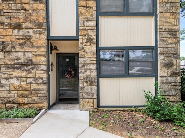 5229 Nowata Rd Unit F101, Bartlesville, OK 74006 - view of exterior entry featuring stone siding