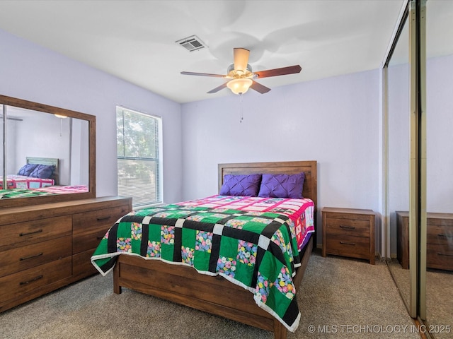 5229 Nowata Rd Unit F101, Bartlesville, OK 74006 - bedroom featuring carpet floors and ceiling fan