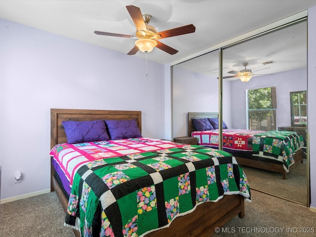 5229 Nowata Rd Unit F101, Bartlesville, OK 74006 - bedroom with carpet flooring, a closet, and a ceiling fan
