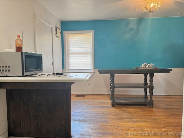 9763 E 3rd St, Tulsa, OK 74128 - unfurnished office featuring wood finished floors and baseboards