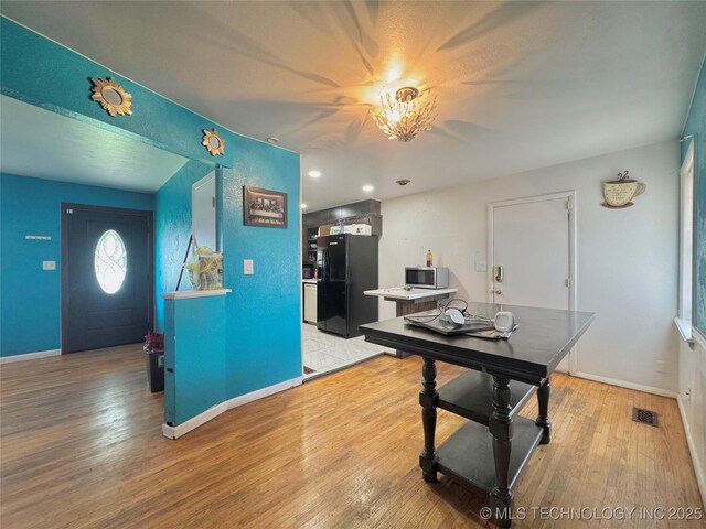 9763 E 3rd St, Tulsa, OK 74128 - dining room featuring light wood-type flooring