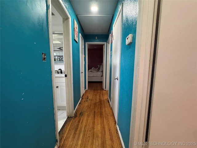 9763 E 3rd St, Tulsa, OK 74128 - hallway with wood finished floors