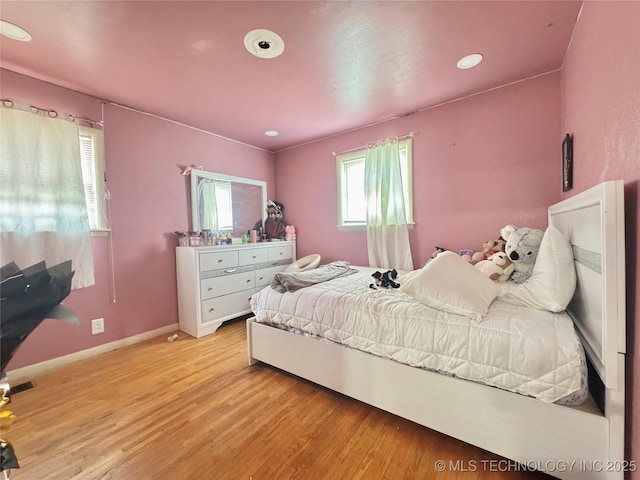 9763 E 3rd St, Tulsa, OK 74128 - bedroom featuring light wood finished floors and recessed lighting