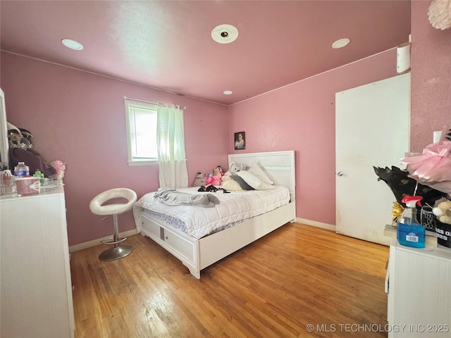 9763 E 3rd St, Tulsa, OK 74128 - bedroom featuring wood finished floors and baseboards