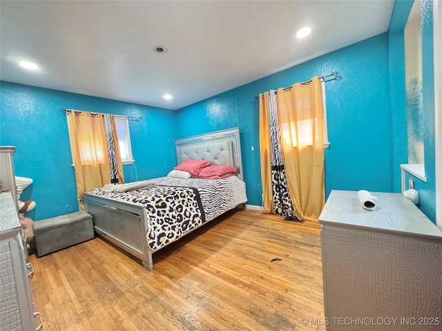 9763 E 3rd St, Tulsa, OK 74128 - bedroom featuring wood finished floors and recessed lighting