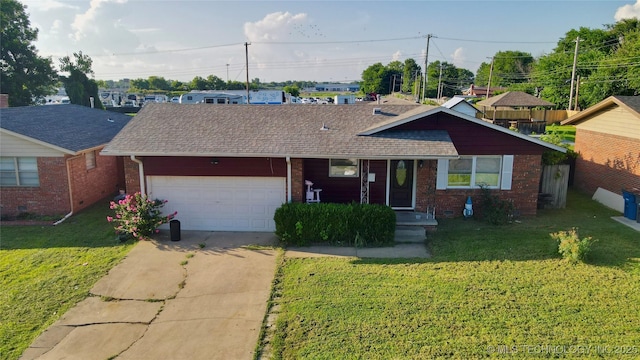 9763 E 3rd St, Tulsa, OK 74128 - view of front facade with an attached garage, brick siding, concrete driveway, and roof with shingles
