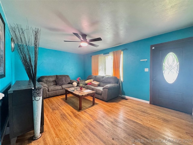9763 E 3rd St, Tulsa, OK 74128 - living area featuring light wood-style floors, ceiling fan, and a textured ceiling