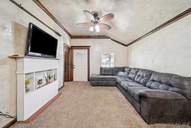236 W 9th Ave, Bristow, OK 74010 - living area featuring ornamental molding, carpet flooring, a ceiling fan, vaulted ceiling, and a textured ceiling