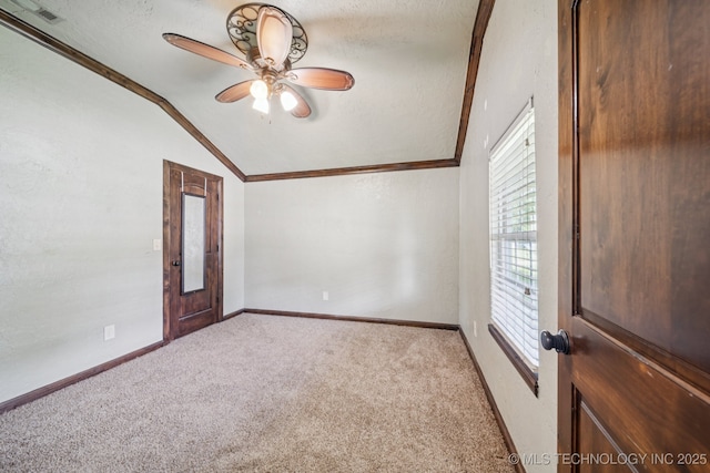 236 W 9th Ave, Bristow, OK 74010 - unfurnished room featuring vaulted ceiling, light colored carpet, ornamental molding, ceiling fan, and a textured ceiling