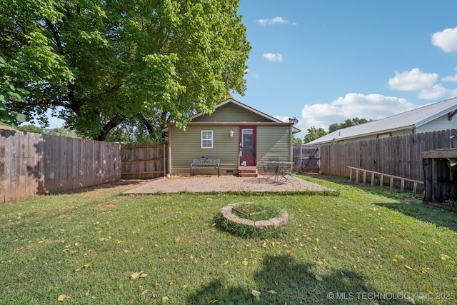 236 W 9th Ave, Bristow, OK 74010 - rear view of property featuring a fenced backyard, a patio, and entry steps