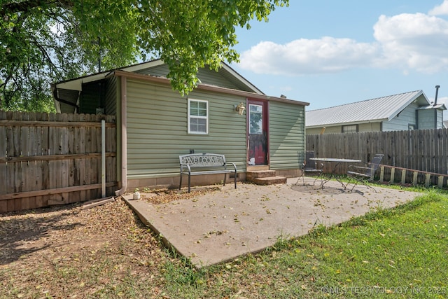 236 W 9th Ave, Bristow, OK 74010 - rear view of property with a patio and a fenced backyard