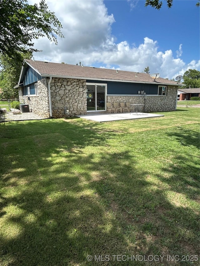 12976 E 32nd St, Tulsa, OK 74134 - back of house featuring stone siding, a patio area, and a yard