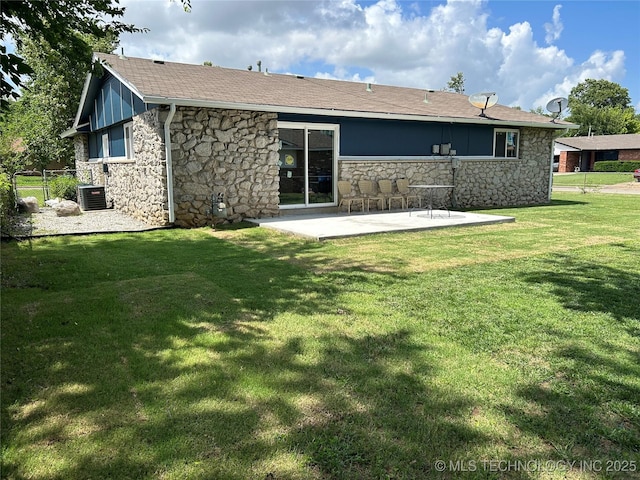 12976 E 32nd St, Tulsa, OK 74134 - back of house with stone siding, a patio area, a lawn, and a shingled roof