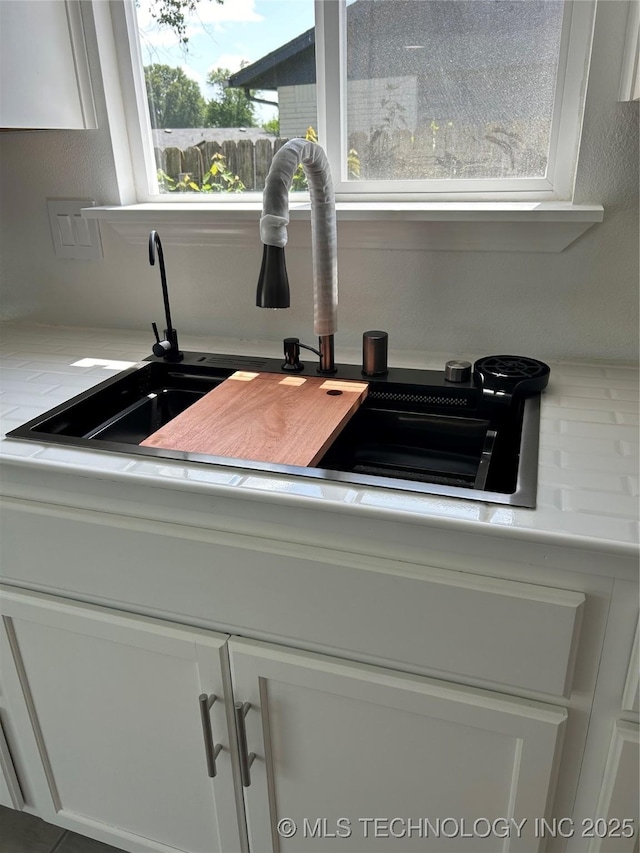 12976 E 32nd St, Tulsa, OK 74134 - kitchen view of white cabinetry and light countertops