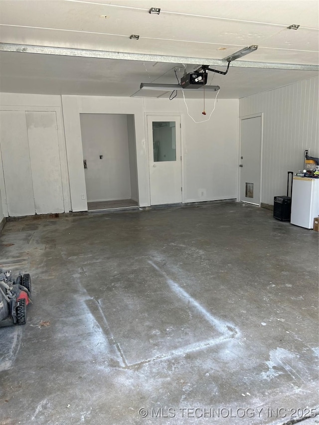 12976 E 32nd St, Tulsa, OK 74134 - garage featuring a garage door opener