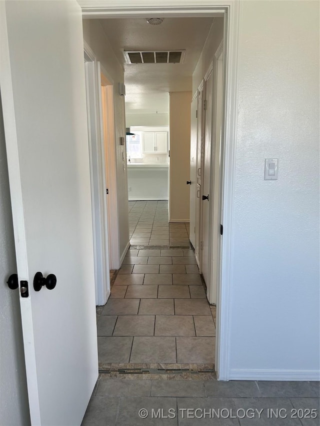 12976 E 32nd St, Tulsa, OK 74134 - hall featuring tile patterned flooring