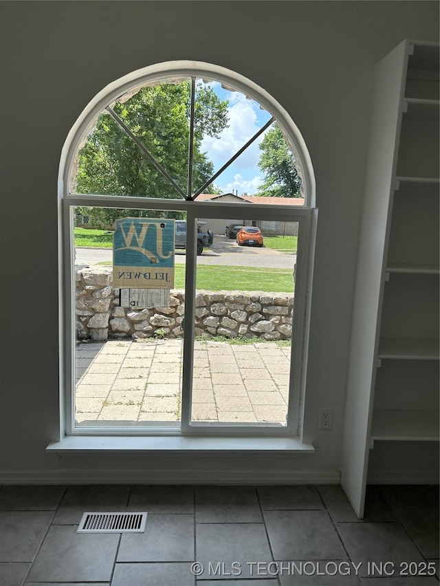 12976 E 32nd St, Tulsa, OK 74134 - doorway with tile patterned floors and plenty of natural light