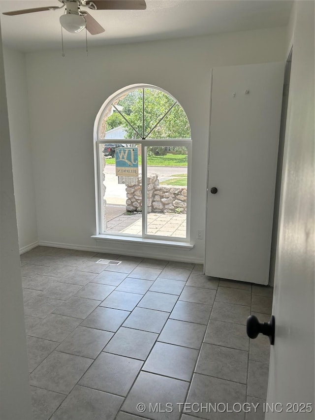 12976 E 32nd St, Tulsa, OK 74134 - unfurnished room with tile patterned flooring and a ceiling fan