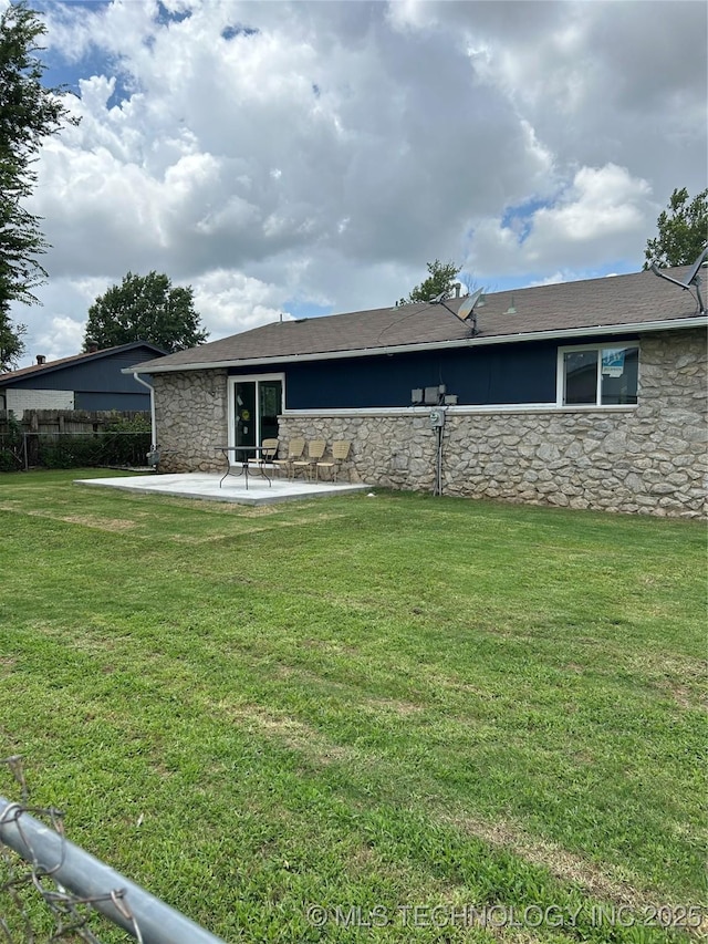 12976 E 32nd St, Tulsa, OK 74134 - view of front facade with stone siding, a patio, and a front lawn