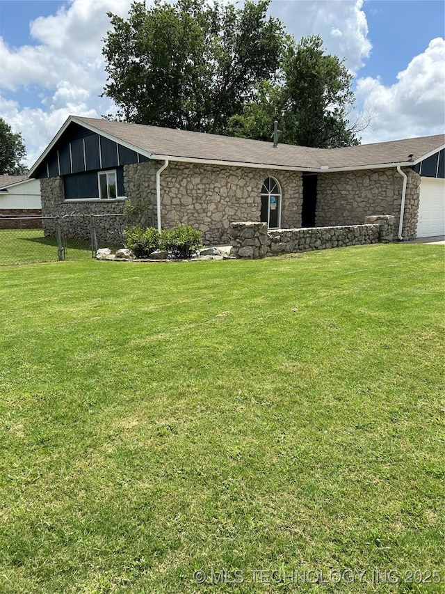 12976 E 32nd St, Tulsa, OK 74134 - view of front of home with stone siding, a garage, and board and batten siding