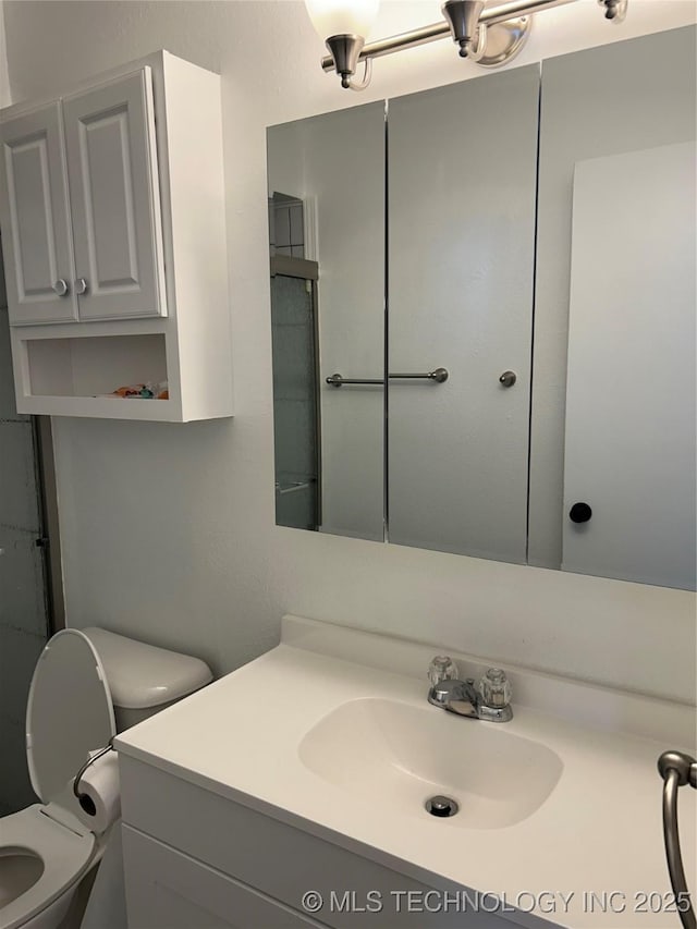 12976 E 32nd St, Tulsa, OK 74134 - bathroom featuring vanity and toilet