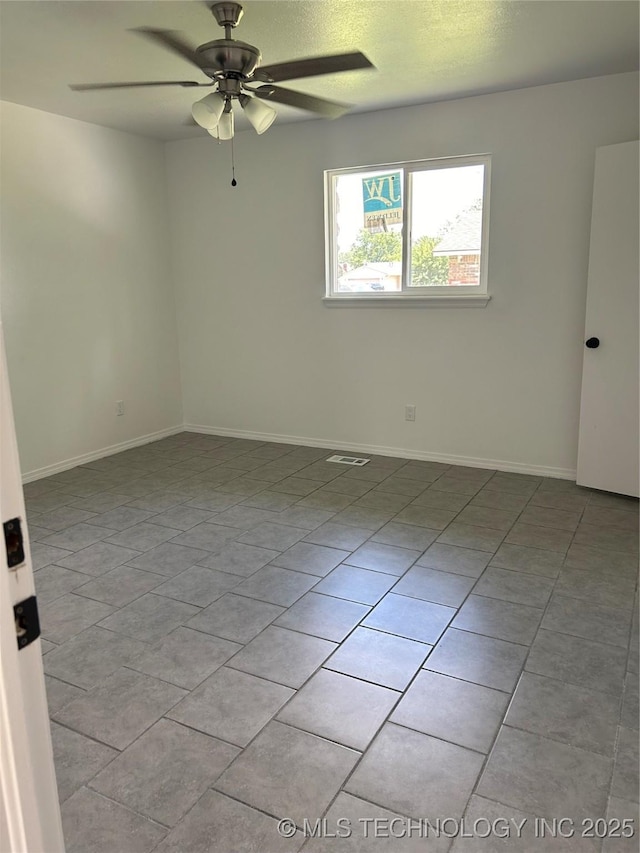 12976 E 32nd St, Tulsa, OK 74134 - spare room with ceiling fan and light tile patterned floors